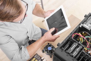 Technician Working with Tablet